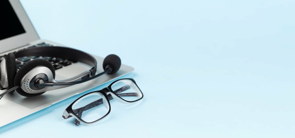 Onsite and remote IT support from CRT Network Solutions - close up of glasses, headset and laptop