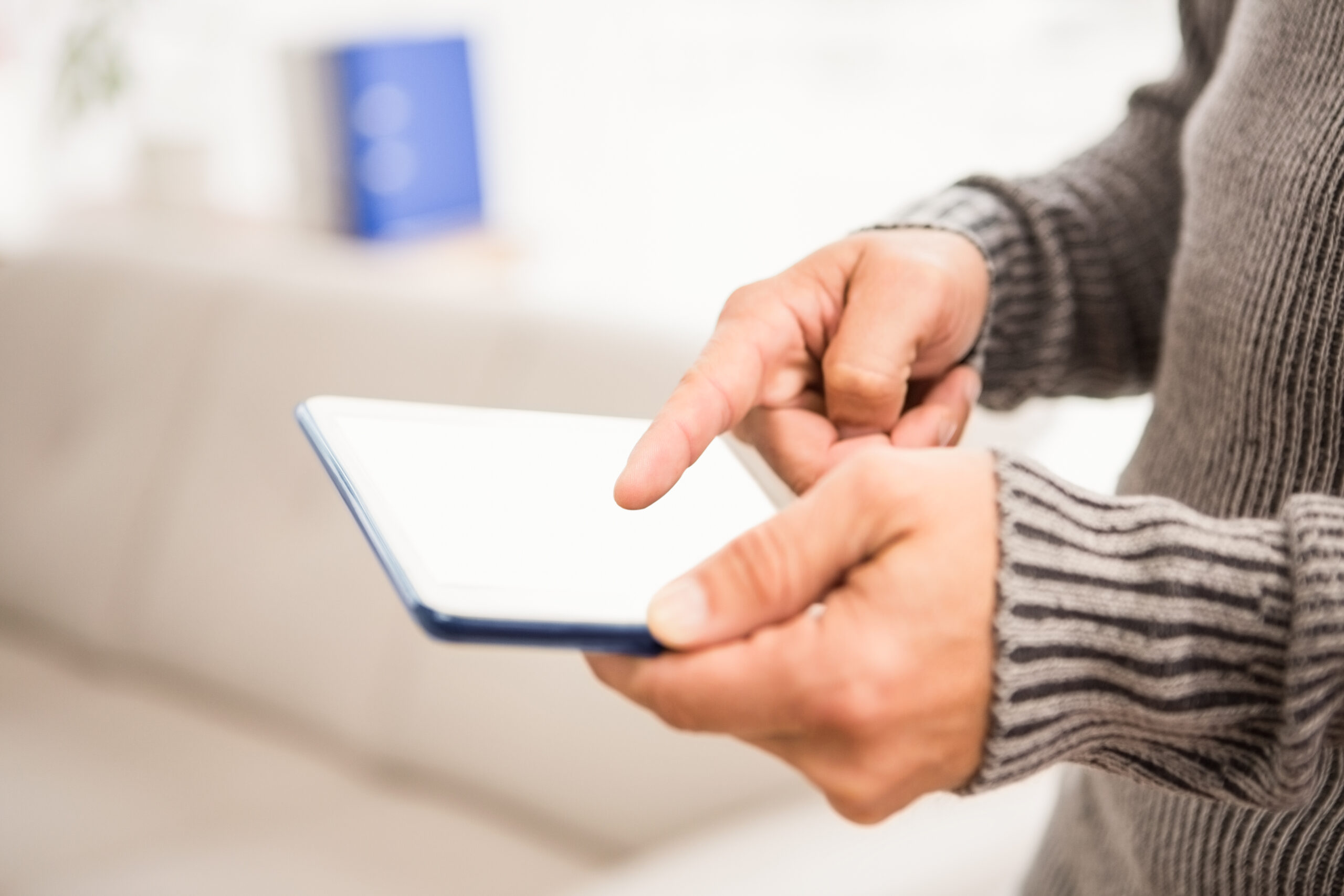 Close up view of hands using tablet in the office