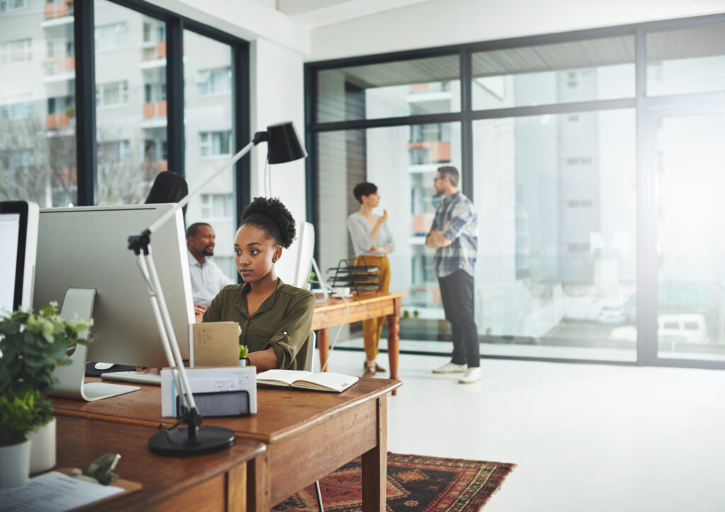 Business team collaborating at a desk in a modern office